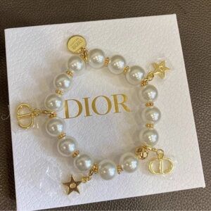 Dior bracelet with cream pearls and gold charms